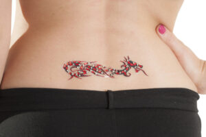 1083 - Dragon Lower Back Gem Tattoo